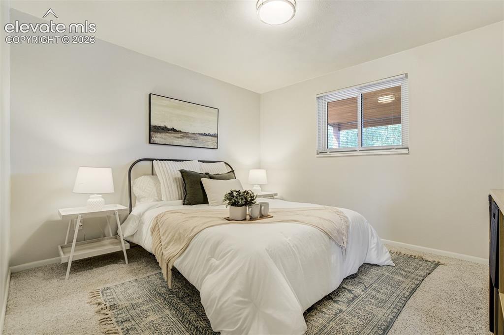 Image 14 of 44: Close to the full bathroom and far enough from the chaos downstairs. We cal