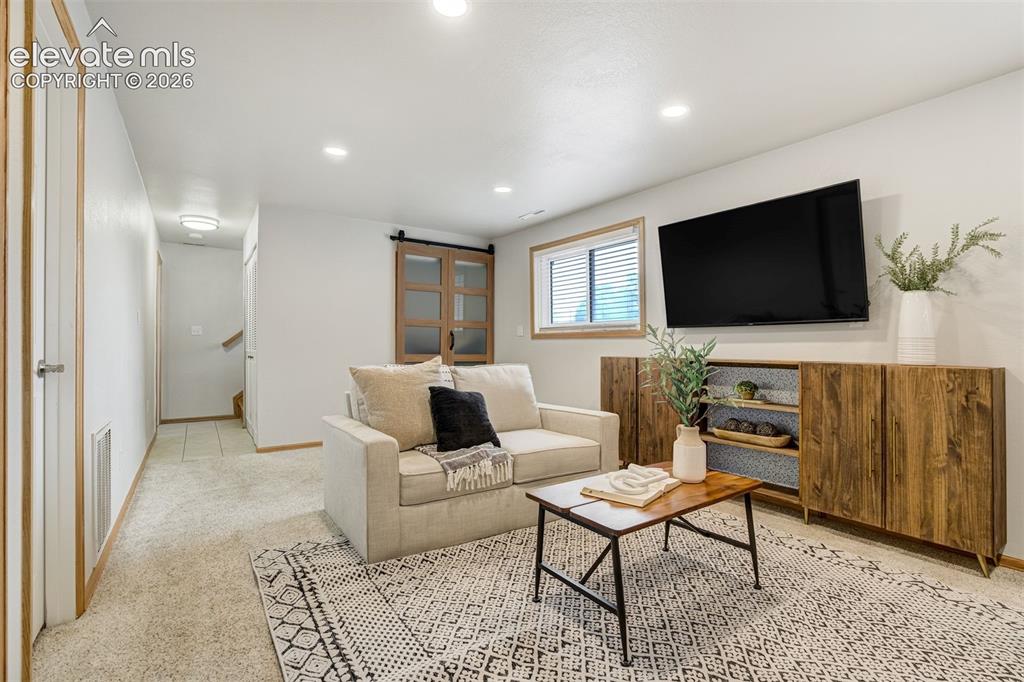 Image 20 of 44: Movie night? Game night? Separate space for "those" family members?