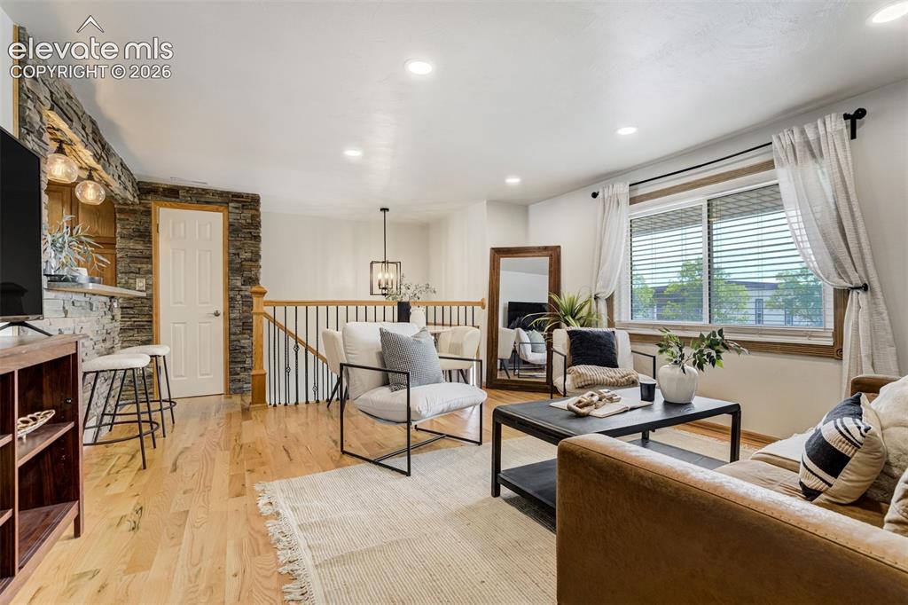 Image 3 of 44: A warm & inviting living room. No builder-grade here, sorry. 