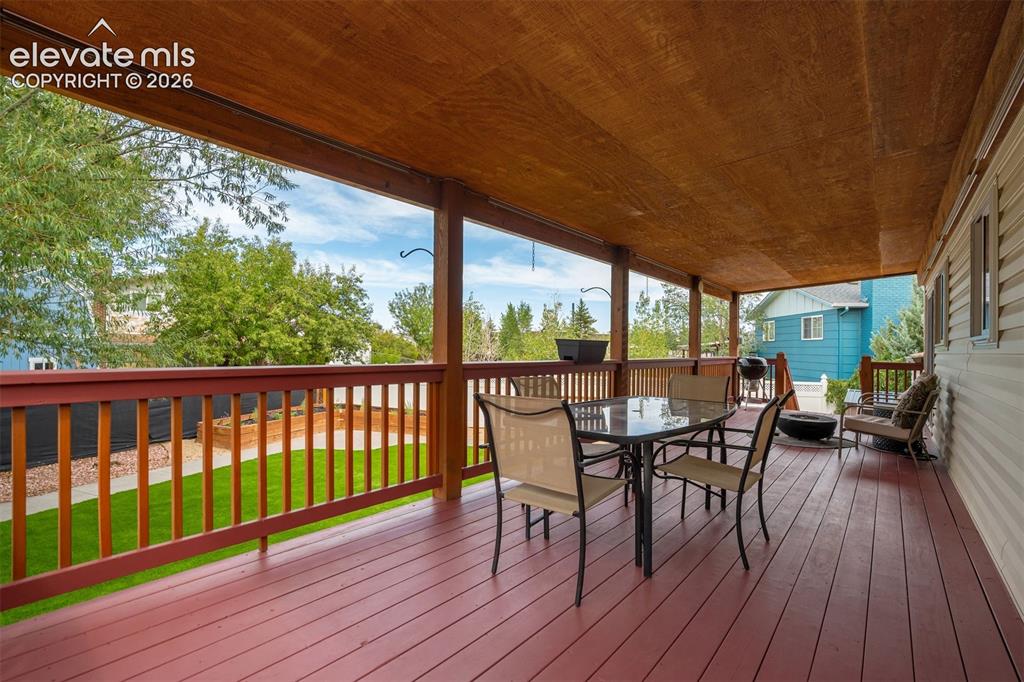 Image 33 of 44: This deck runs the entire length of the house because apparently “a little