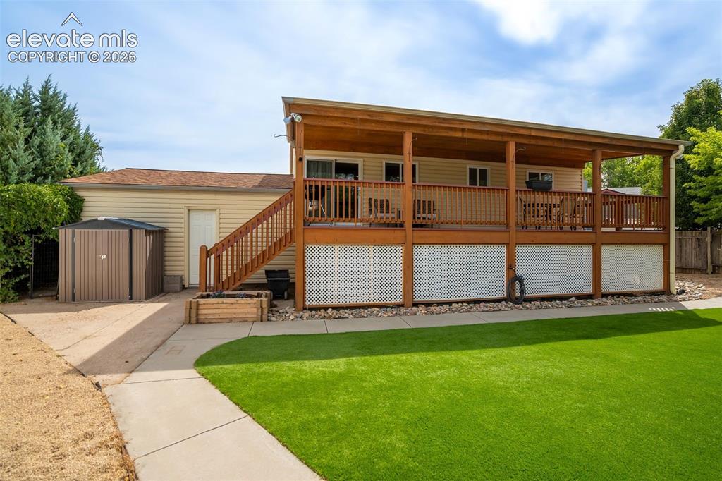 Image 35 of 44: Low-maintenance turf + garden beds + a huge yard = less yard work, more act