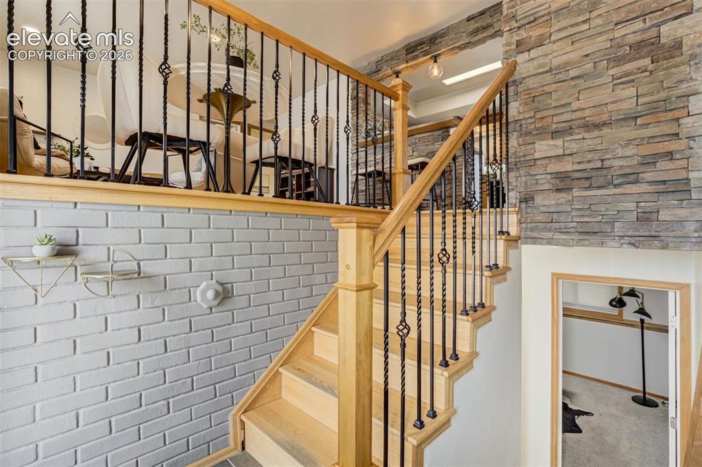 Image 42 of 44: We love a good stone accent wall at an entry. 