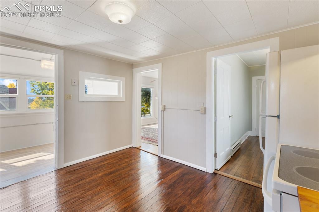 Image 18 of 49: Entrance foyer featuring hardwood / wood-style floors and a baseboard radia