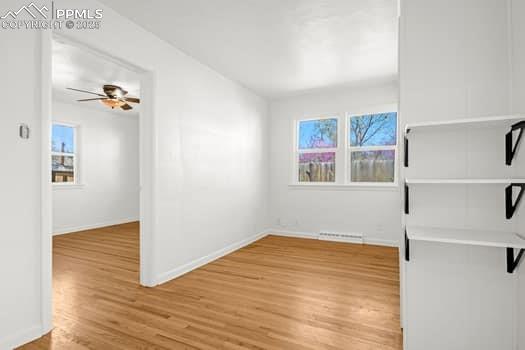 Image 18 of 25: Unfurnished room featuring light wood-style floors, a healthy amount of sun