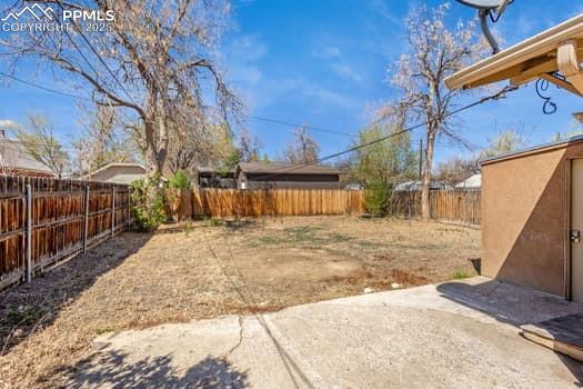 Image 25 of 25: View of yard featuring a patio area and a fenced backyard