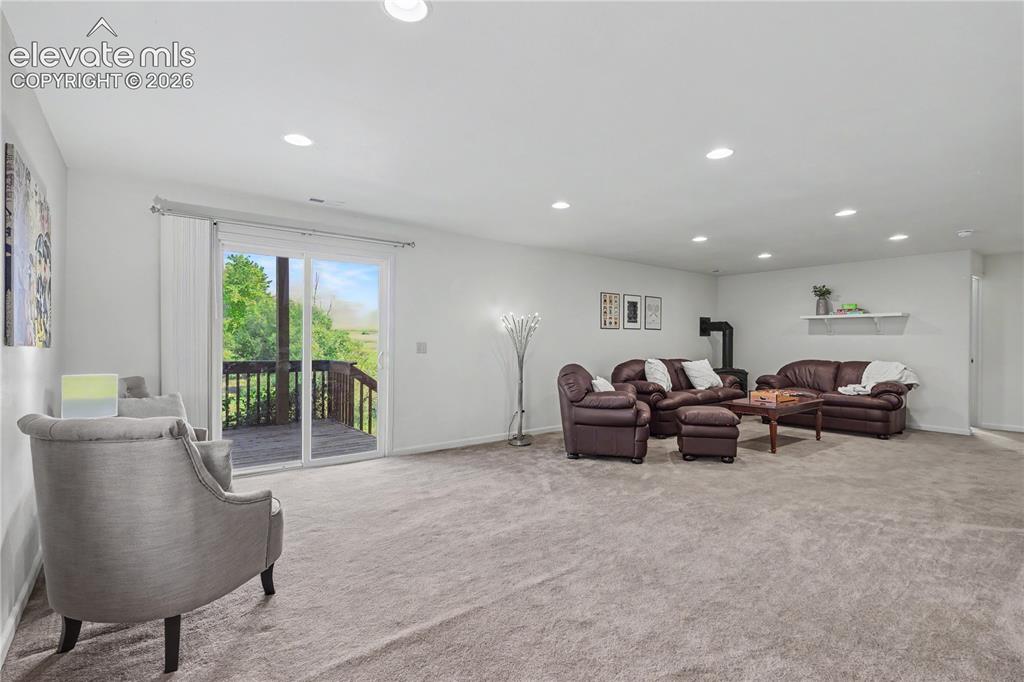 Image 29 of 41: Spacious room featuring light gray carpet, recessed lighting, white walls,
