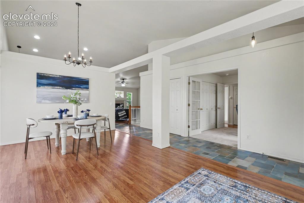 Image 4 of 41: Spacious Living Room off the entry w/ Formal Dining Room featuring wood-fin