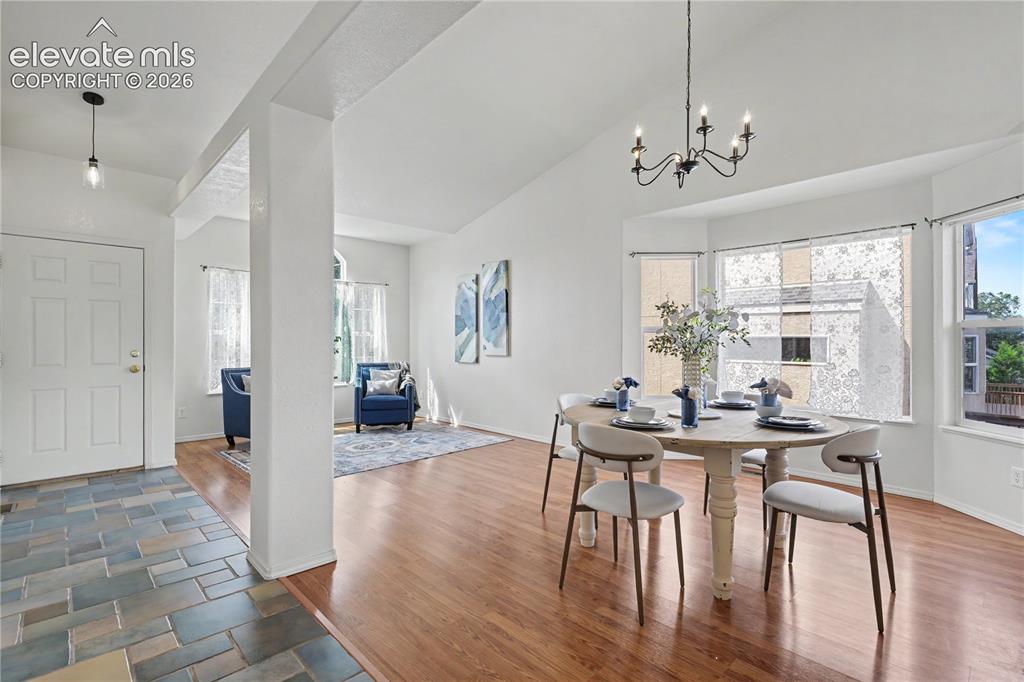 Image 5 of 41: Spacious Living Room off the entry w/ Formal Dining Room featuring wood-fin