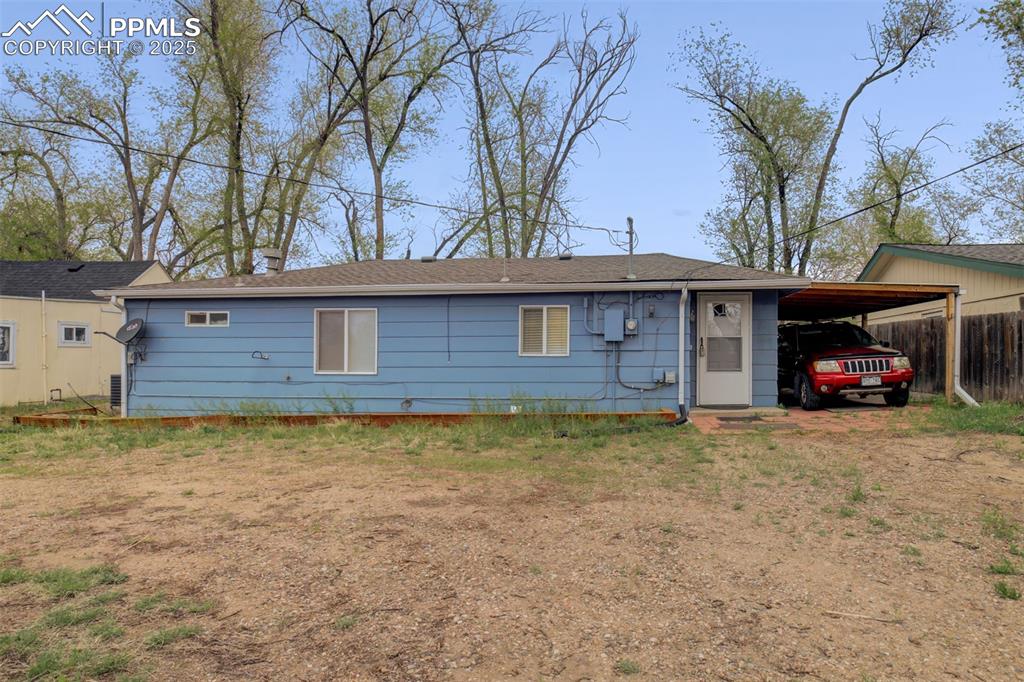 Image 19 of 22: Ranch-style home with a carport