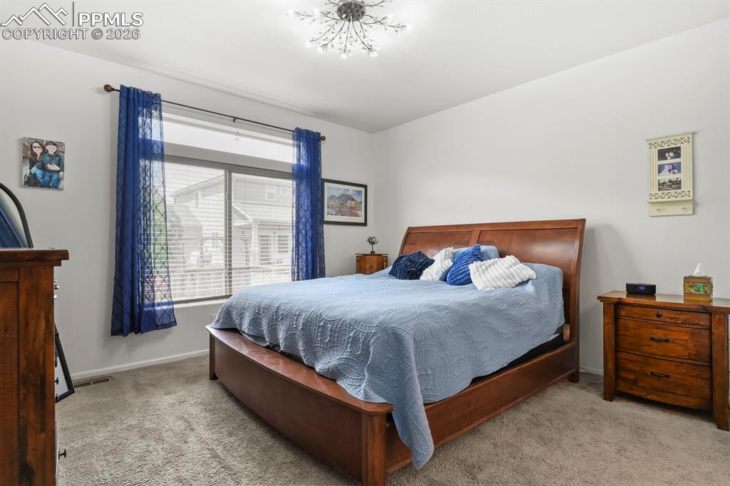 Image 19 of 39: Nice primary bedroom on the main level