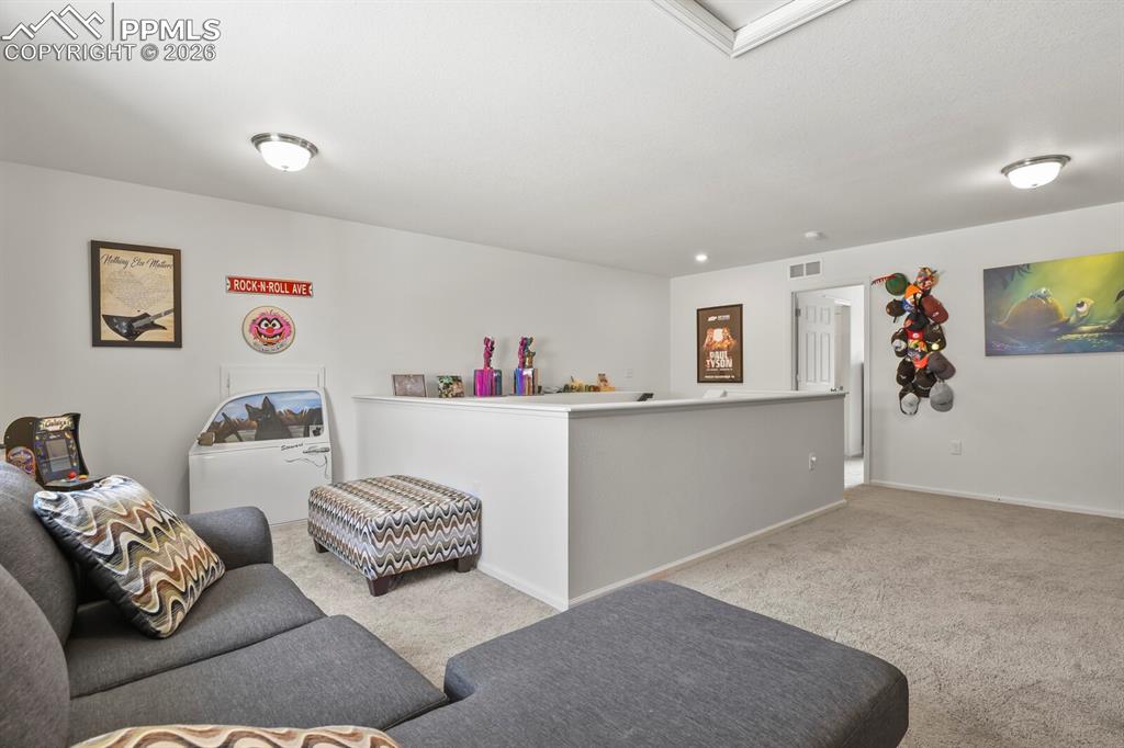 Image 28 of 39: Upper level spacious loft area