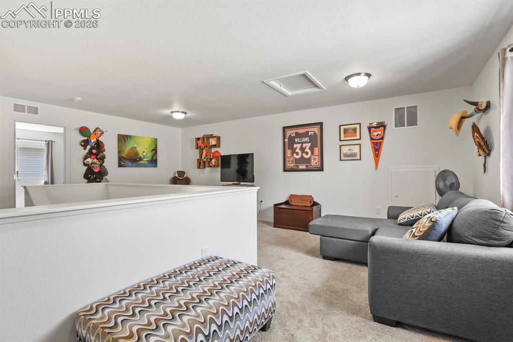 Image 29 of 39: Upper level spacious loft area