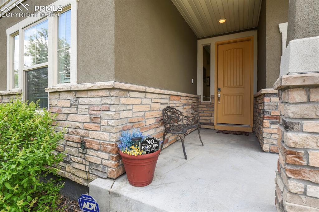 Image 3 of 39: Inviting entryway featuring a covered porch