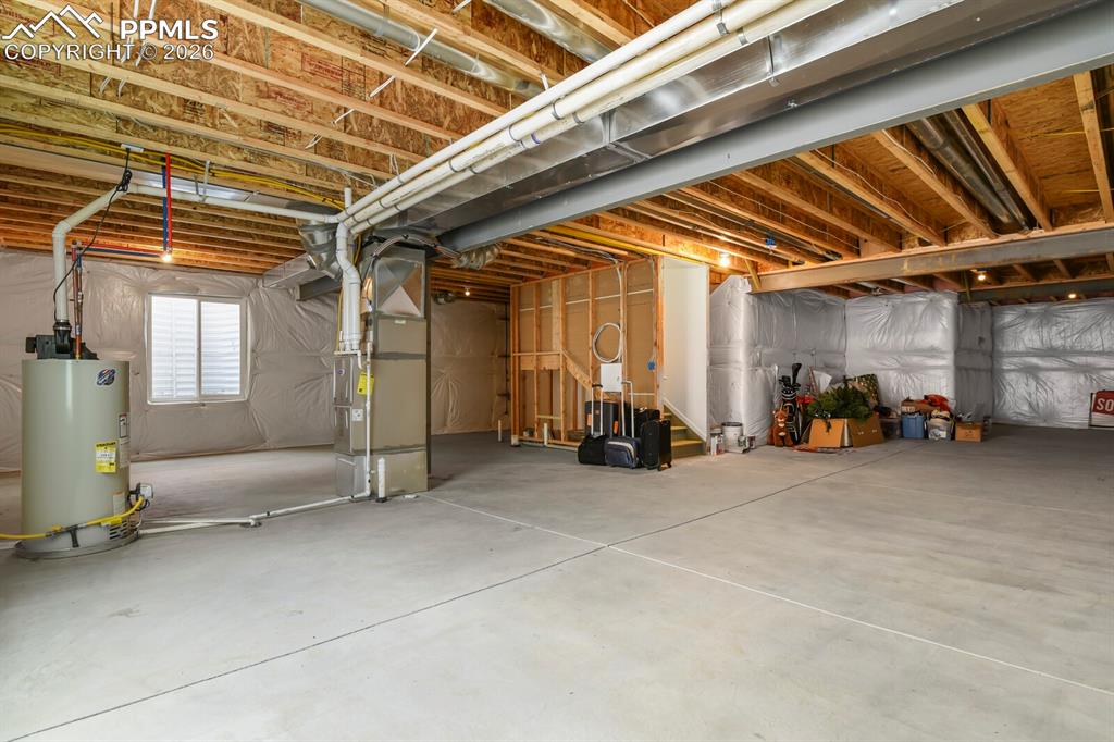 Image 33 of 39: Unfinished basement with a ton of potential