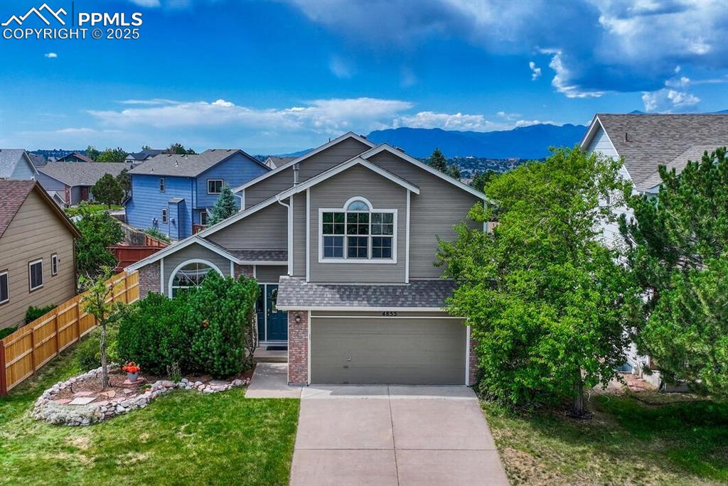 Caption: Two-story home across from Fairfax Park showcases great Pikes Peak views in School District 20! 