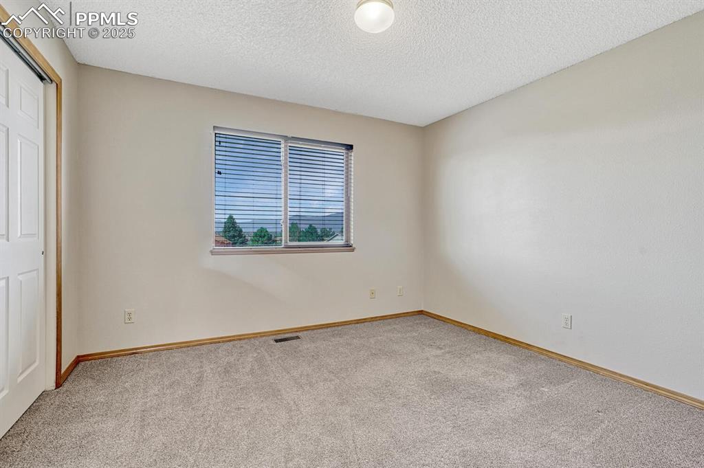 Image 30 of 50: Secondary bedrooms have mountain views!