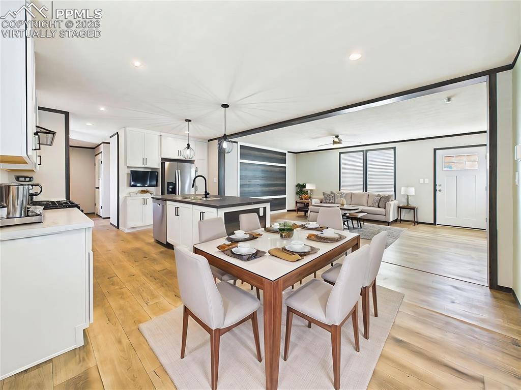 Image 14 of 50: (Virtually Staged) Kitchen & Dining Area – Open kitchen with large center i