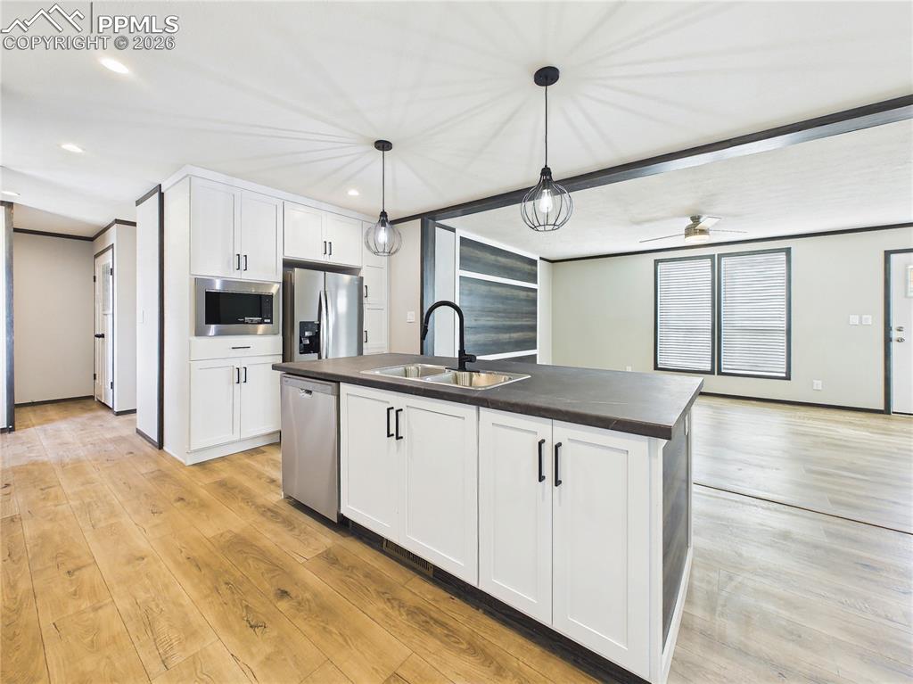 Image 15 of 50: Kitchen (Wide View) – Well-designed kitchen layout with generous cabinetry,