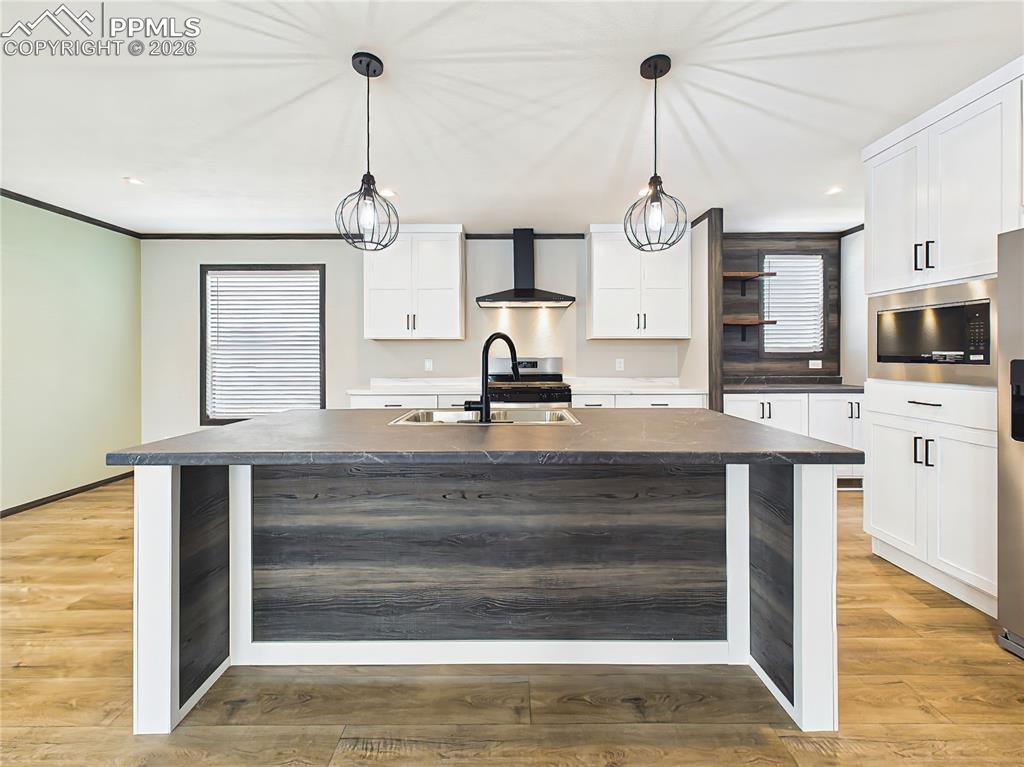 Image 17 of 50: Kitchen Island – Spacious island with dual-basin sink, ample prep space, an