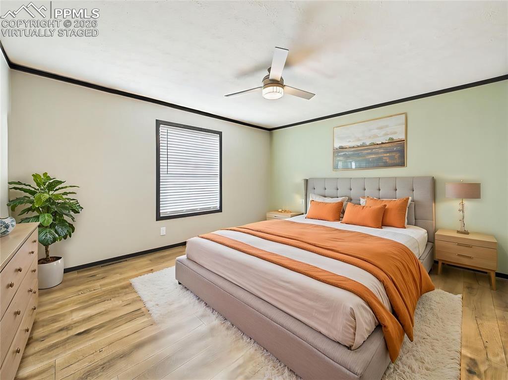 Image 27 of 50: (Virtually Staged) – Staged bedroom highlighting a relaxed and comfortable