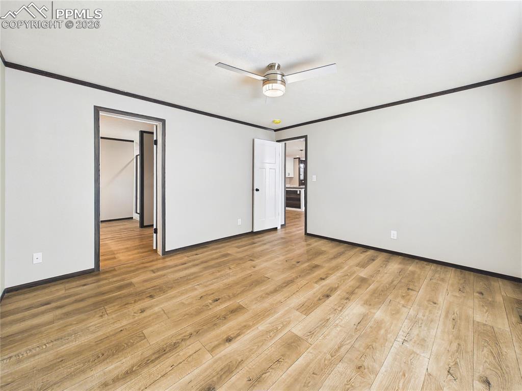 Image 28 of 50: Bedroom – Well-sized bedroom featuring durable flooring, neutral finishes,