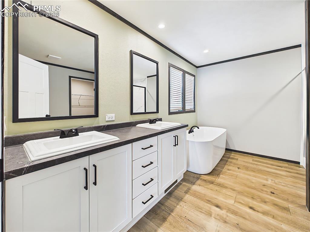 Image 30 of 50: Primary Bathroom – Dual-sink vanity with ample storage, sleek finishes, and