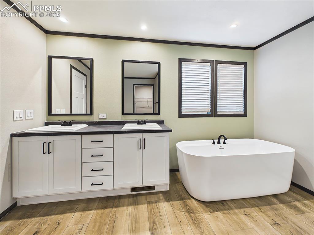 Image 31 of 50: Primary Bathroom (Soaking Tub) – Freestanding soaking tub positioned beneat