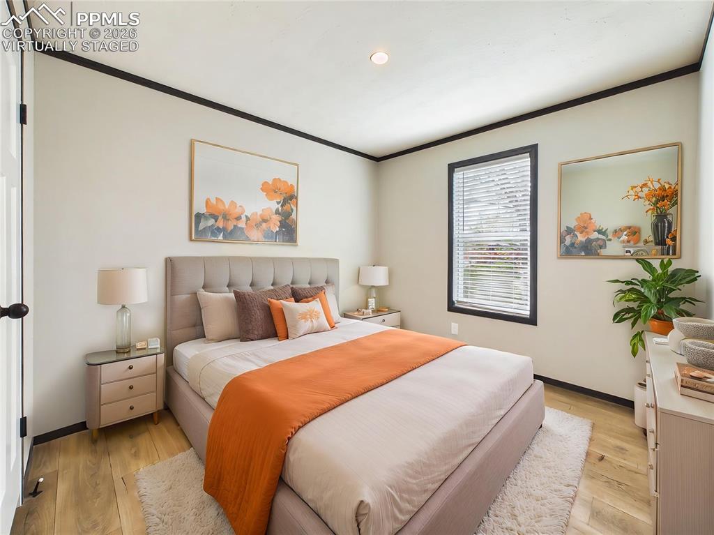 Image 37 of 50: (Virtually Staged) – Comfortable bedroom 2 layout showcasing space for a fu