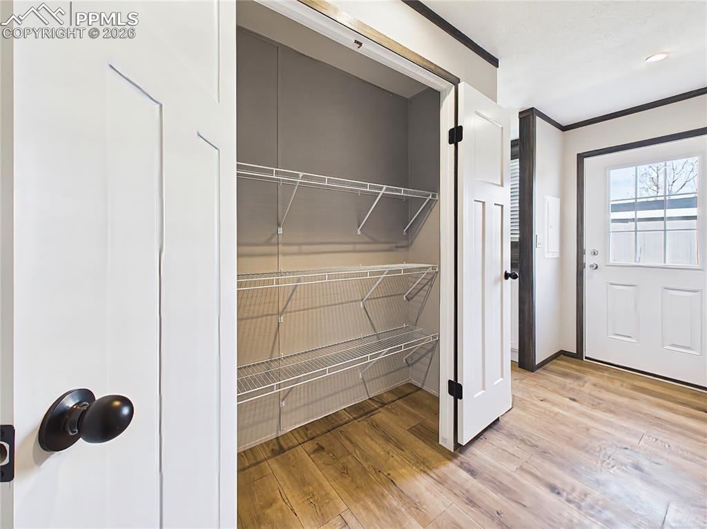 Image 42 of 50: Storage Closet – Additional closet space with built-in shelving, ideal for
