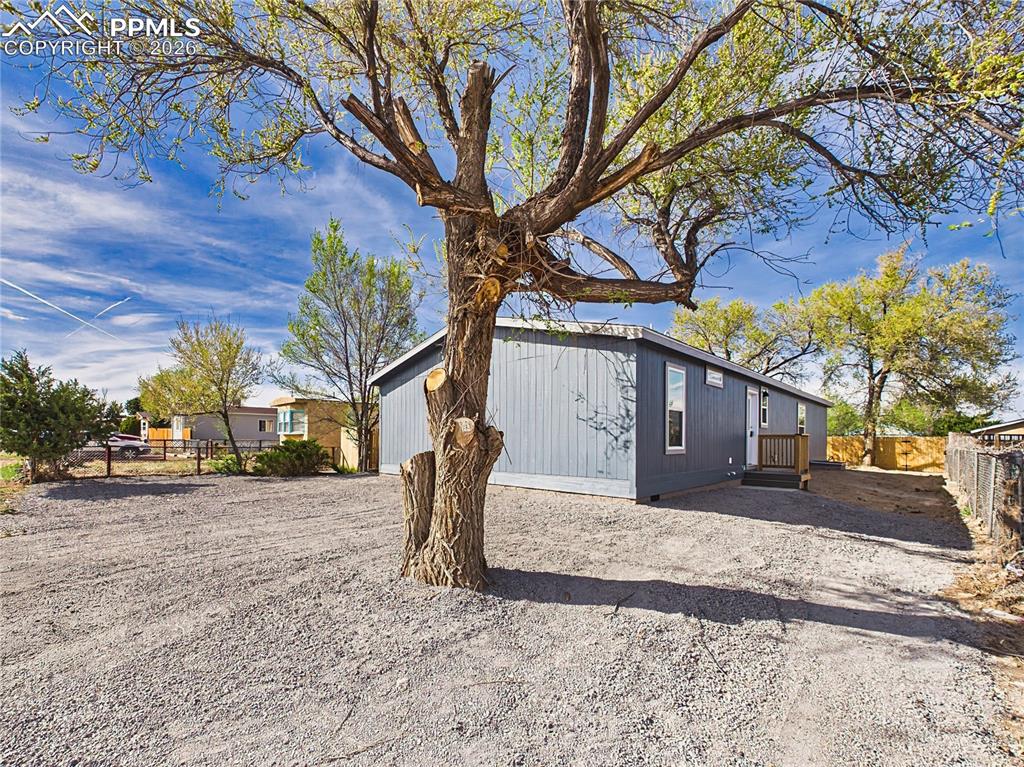 Image 46 of 50: Driveway Area – Large gravel area offering plenty of off-street parking and