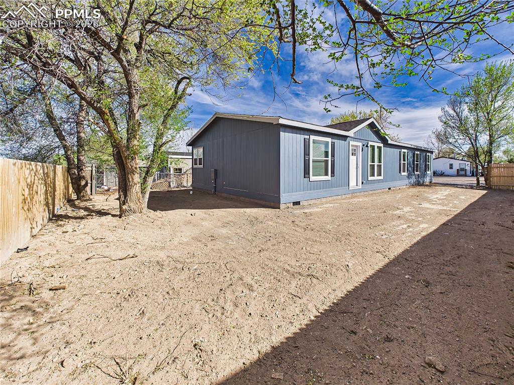 Image 48 of 50: Full view of the home’s exterior showcasing updated siding, multiple window