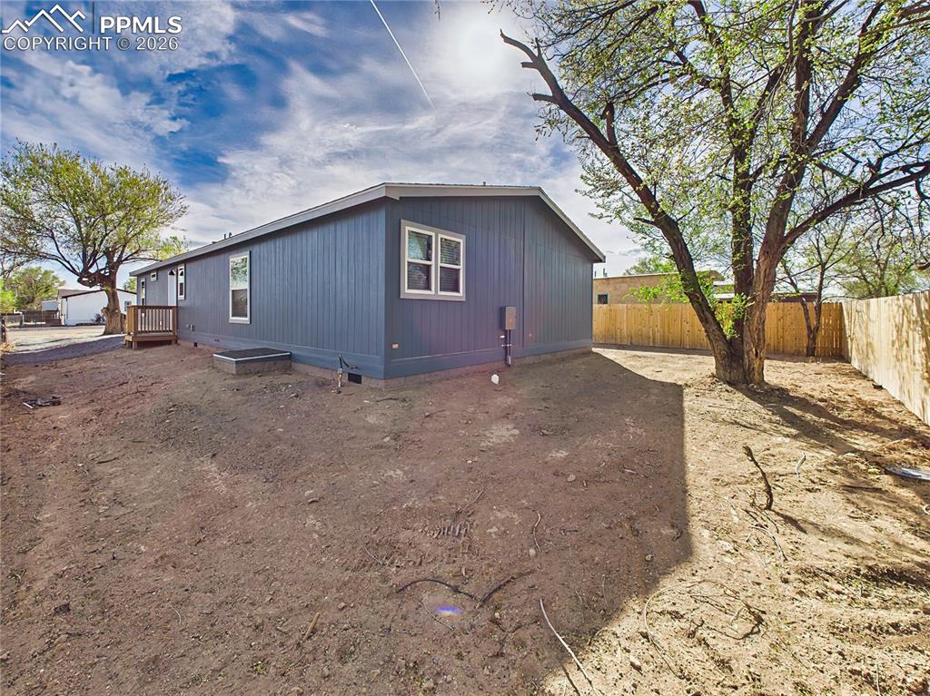 Image 49 of 50: Backyard (Angle View) – Generous yard area with room for customization, fra