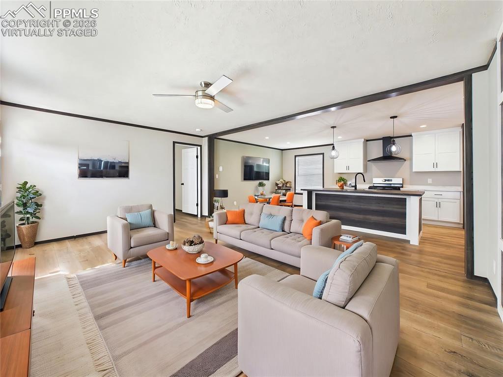 Image 8 of 50: (Virtually Staged) – Staged living space illustrating layout potential with