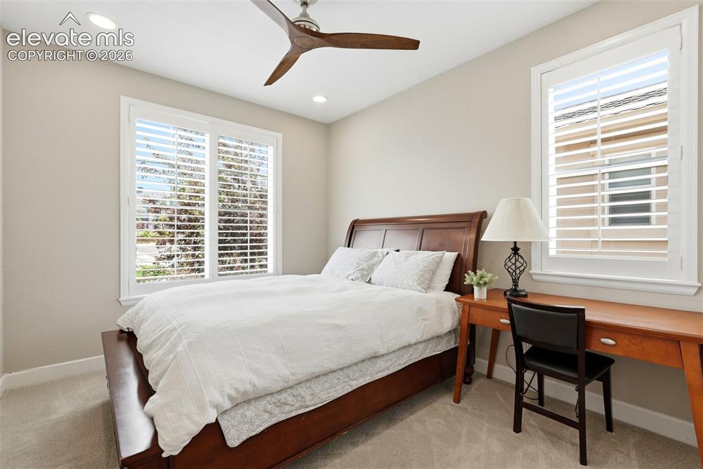 Image 22 of 47: Recessed lighting, ceiling fan, and light-toned carpeting