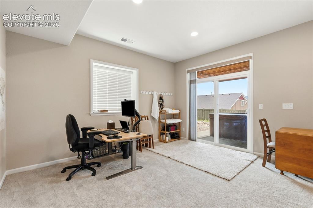 Image 31 of 47: Spacious room featuring neutral paint, recessed lighting, and light-toned c