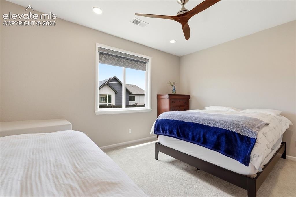 Image 42 of 47: Light-filled interior space featuring neutral wall tones and a window with 