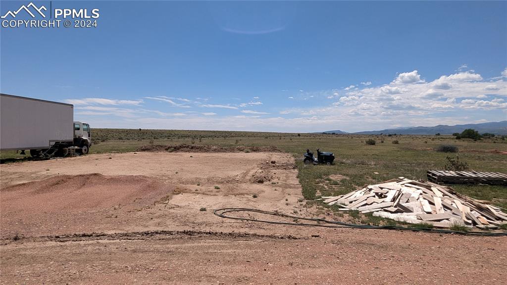 Image 7 of 8: View of yard with a mountain view and a rural view