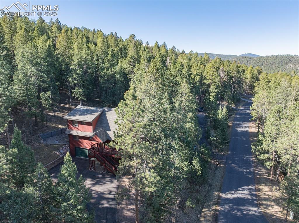 Image 33 of 38: Aerial view of a heavily wooded area