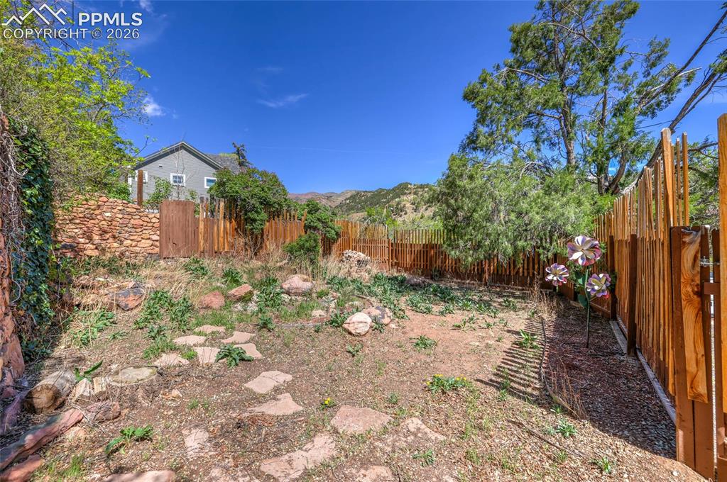Image 34 of 44: Private fully fenced backyard