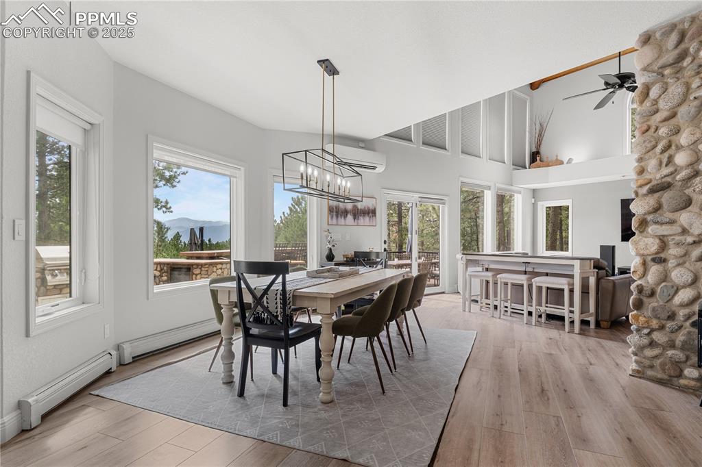 Image 14 of 47: The dining area features luxury flooring, natural light and modern light fi