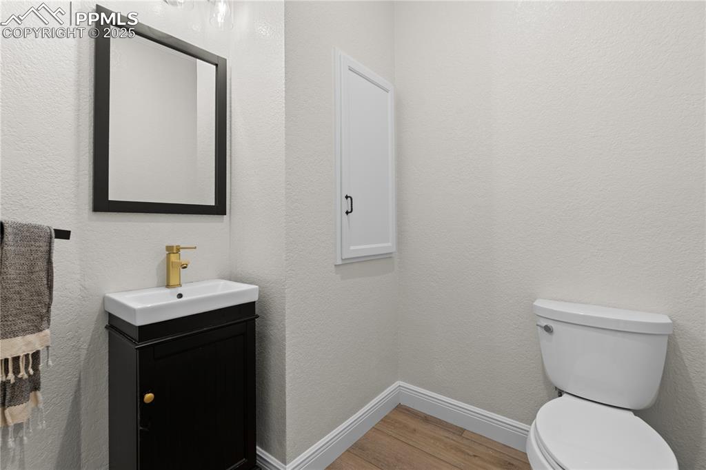 Image 26 of 47: The powder room on the main floors adds convience to guests