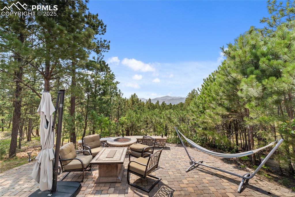 Image 3 of 47: Perfectly curated backyard, privacy, mountain views, and a fire pit.