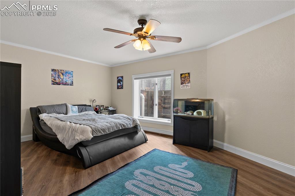 Image 36 of 47: This bedroom in the basement is so light and airy it doesn