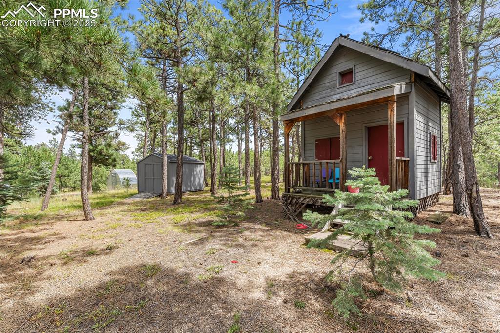 Image 41 of 47: Playhouse is perfect for your private acreage!
