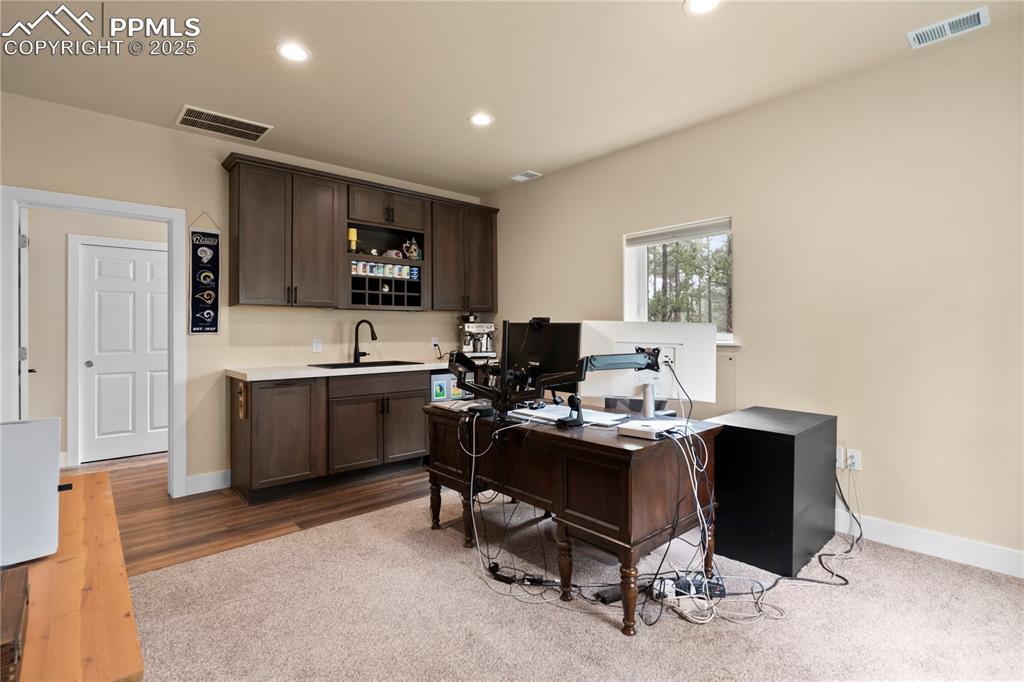 Image 44 of 47: This flex room in the detached garage can be used for many things - has a k