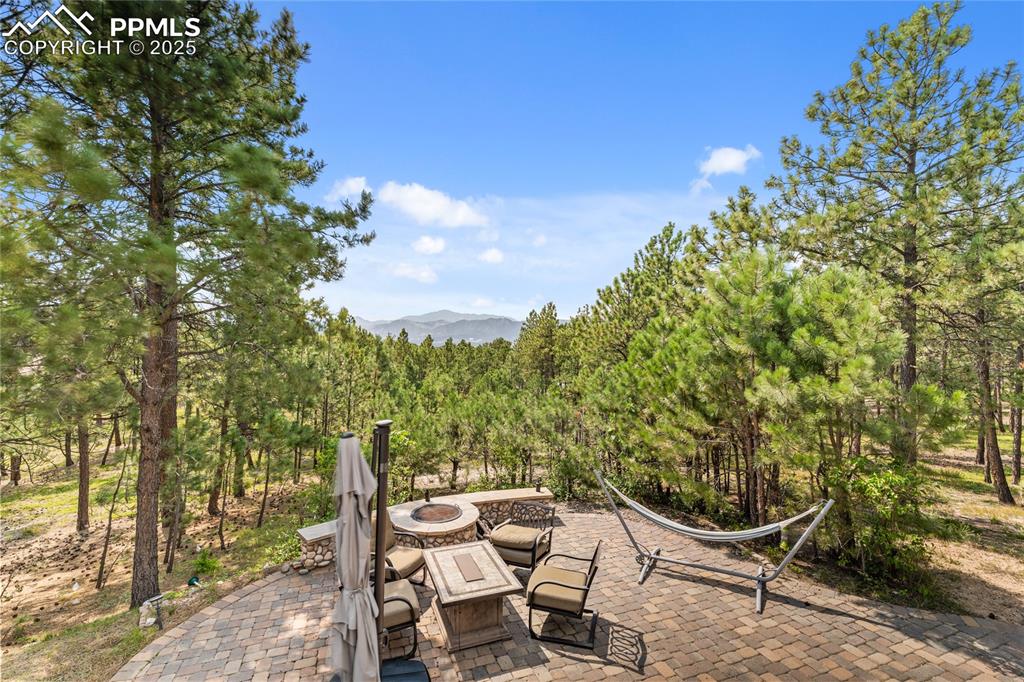 Image 47 of 47: View of patio / terrace featuring a fire pit and a mountain view
