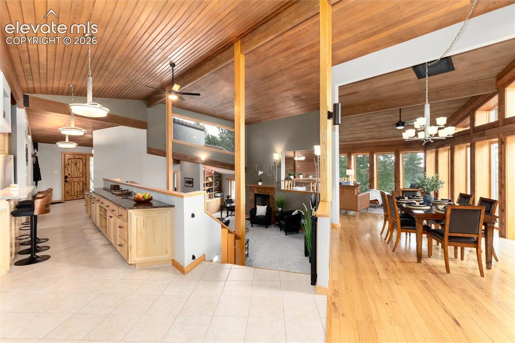 Image 10 of 50: View of kitchen, living room, and dining area. 