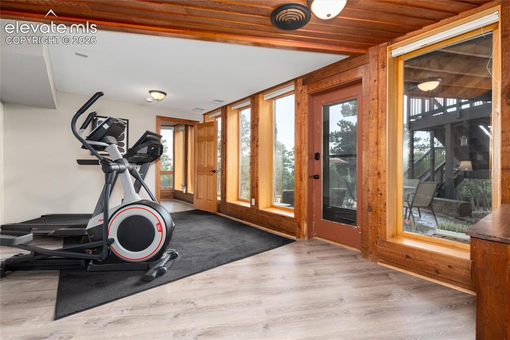 Image 26 of 50: Lower bedroom being used as an exercise room