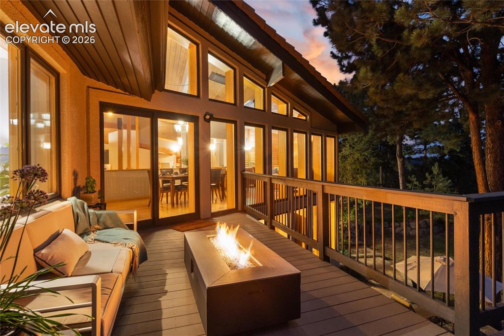 Image 41 of 50: Expansive outdoor deck featuring wood-finish flooring and wood railing