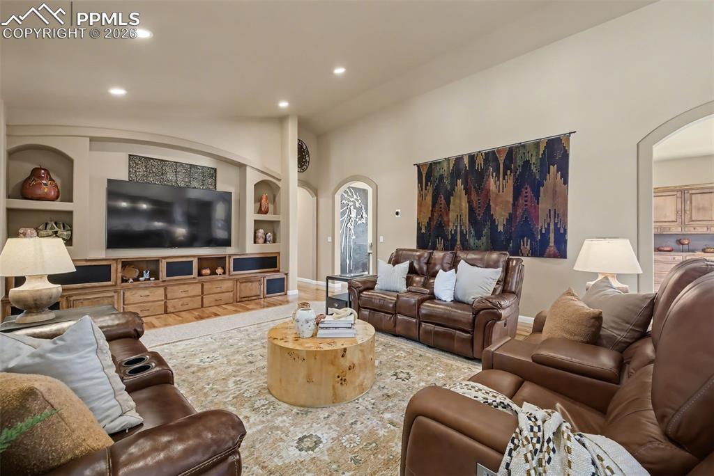 Image 22 of 45: Expansive laundry room with stand-up freezer, drying racks sink and pantry 
